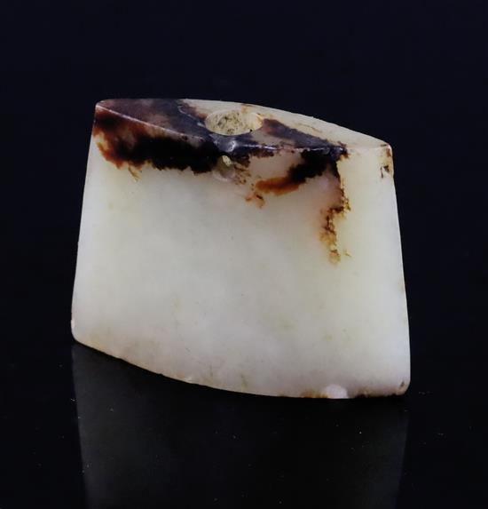 A Chinese pale celadon and brown jade pendant, possibly archaic, W. 4.5cm